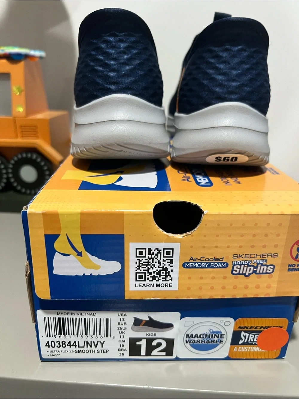 Skechers Kids Navy Slip-On Sneakers with Orange Pull Tab